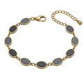Elegant Oval Charm Bracelet – Black & Gold Style